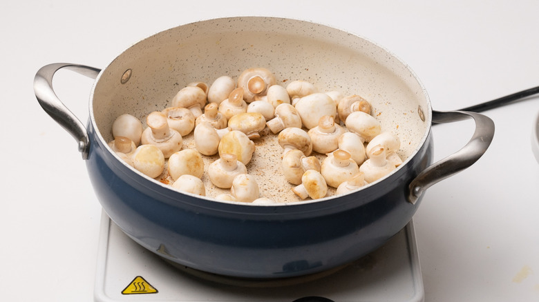 button mushrooms in a pan