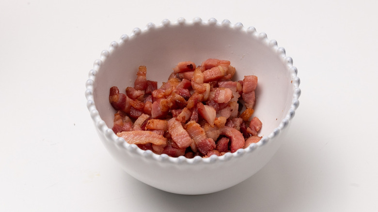 fried bacon lardons in bowl