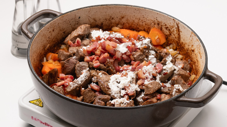 beef bourguignon ingredients in pan