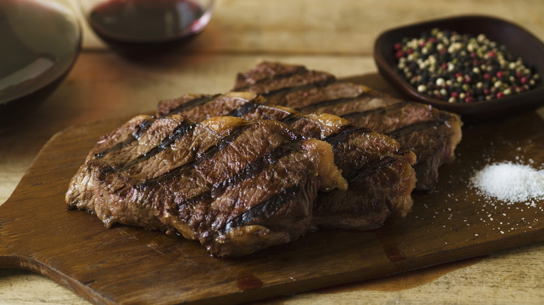 prepared steak on cutting board