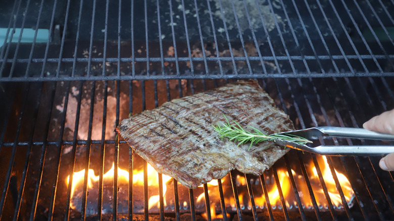 Grilling beef with rosemary