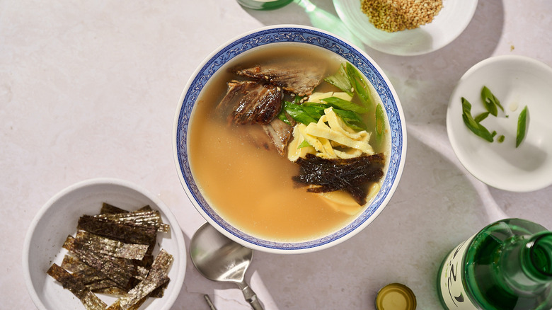 Tteokguk in bowl on table