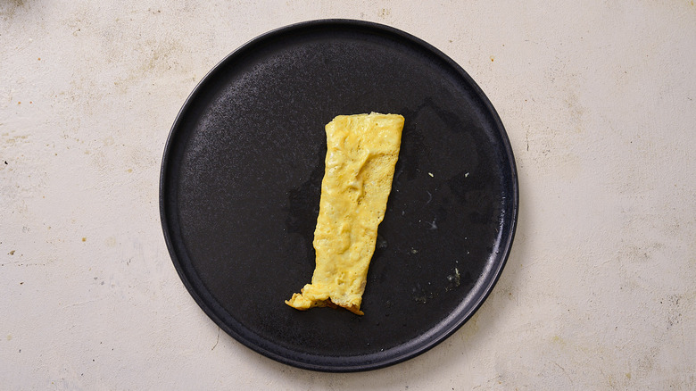 Folded egg onto plate