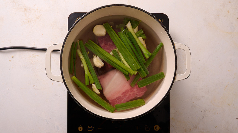 Soup ingredients covered in water