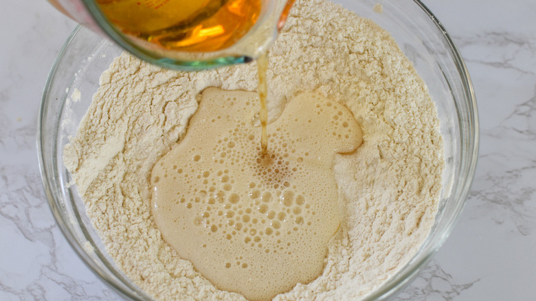 beer pouring into flour