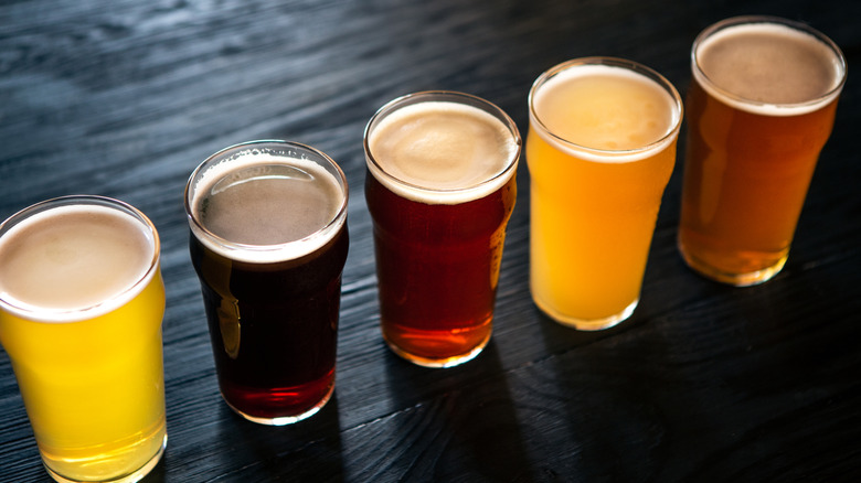 glasses of beer on a wood surface