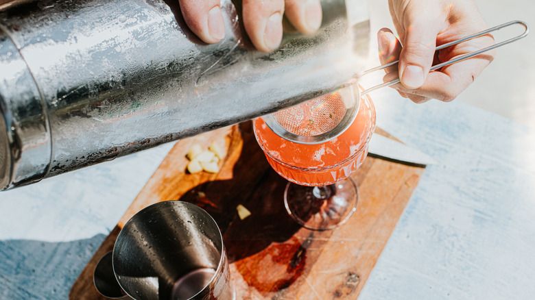 Bartender pouring cocktail