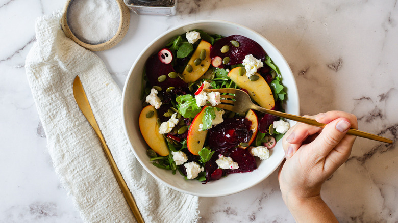 eating salad with fork