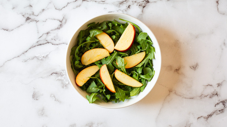 apples on arugula