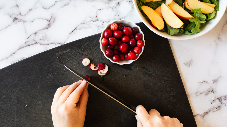 slicing cranberries