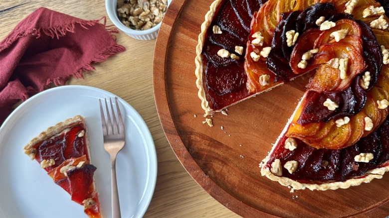 sliced and whole beet and walnut tart