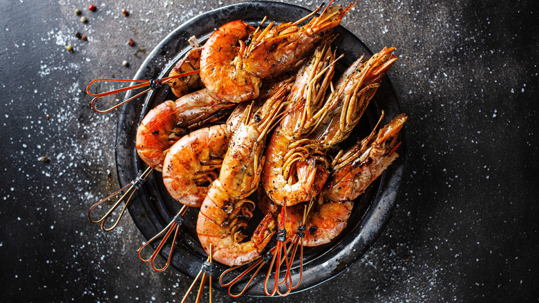 Large barbecued shrimp on plate