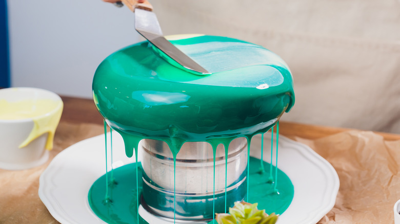 Mirror cake being glazed 