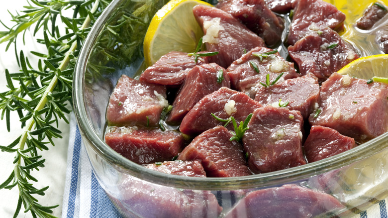 Diced lamb marinating in bowl