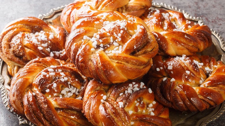 Close-up of Swedish kardemummabullar topped with Swedish pearl sugar