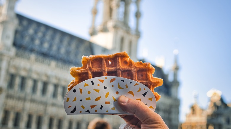 hand holding plain belgian waffle