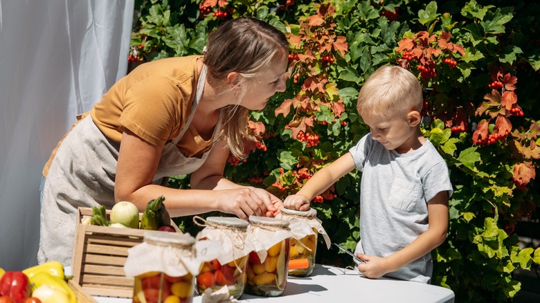 women and son canning