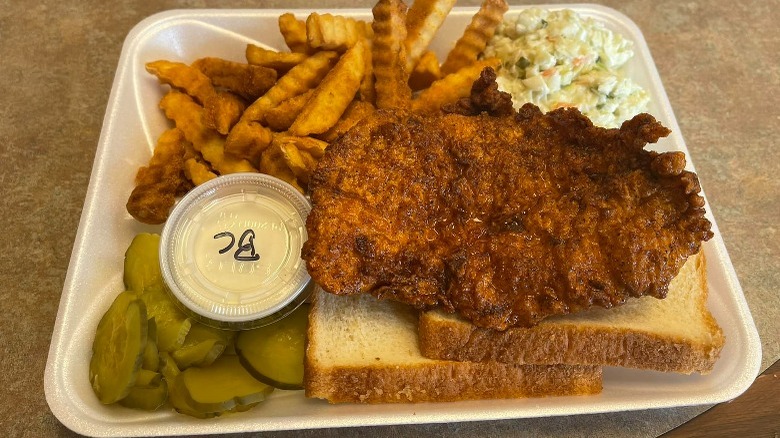 Hot chicken on white bread with sides