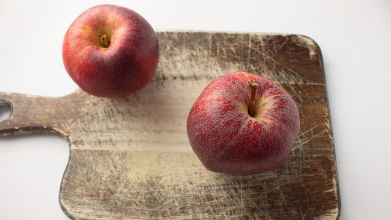 apples on wooden board