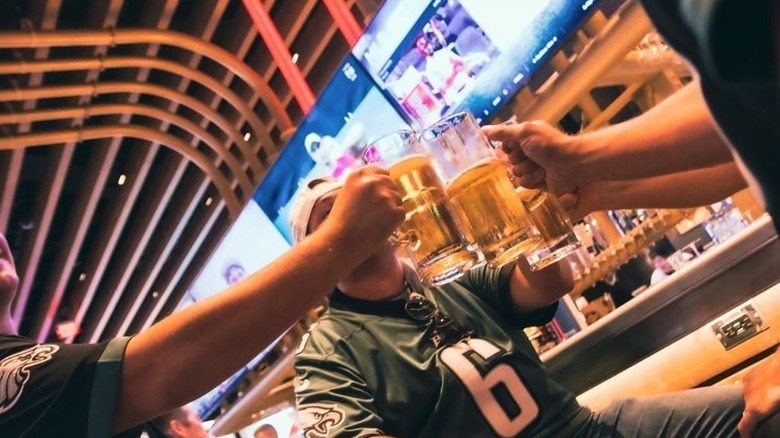 Men toasting beers