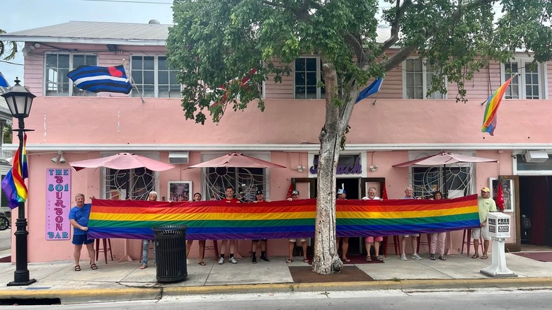 Rainbow flag outside a pink building