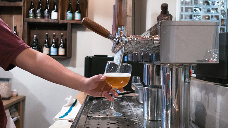 Pouring beer at Monkish Brewing Co