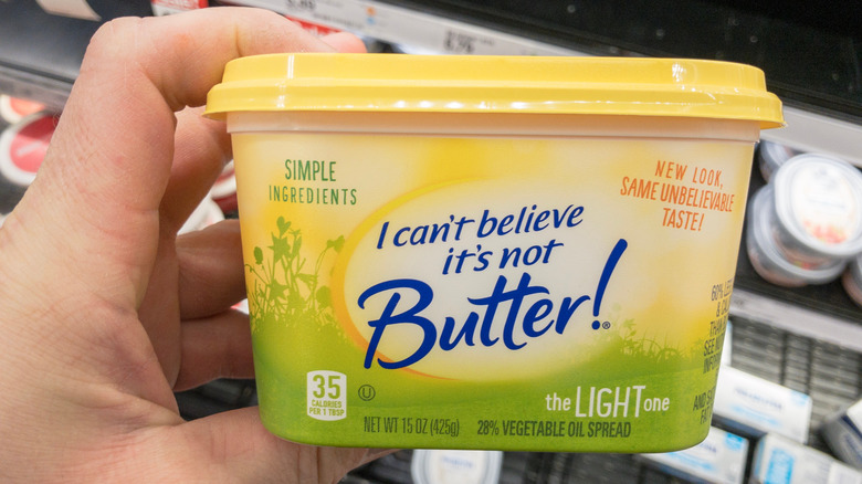 holding tub of I Can't Believe It's Not Butter