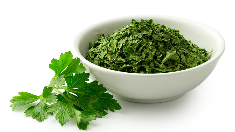 Dried parsley flakes in bowl