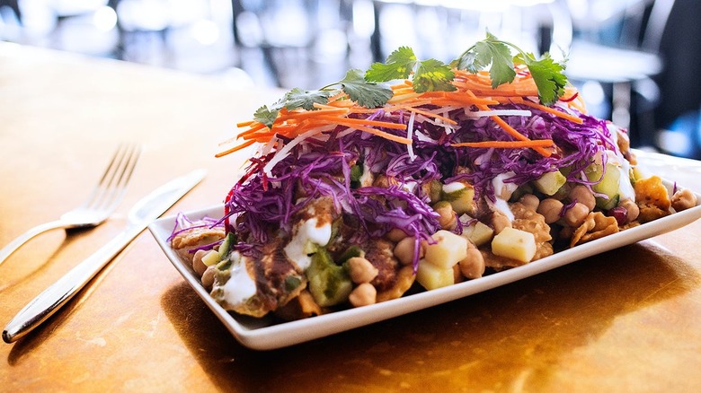 plate piled high with indian nachos