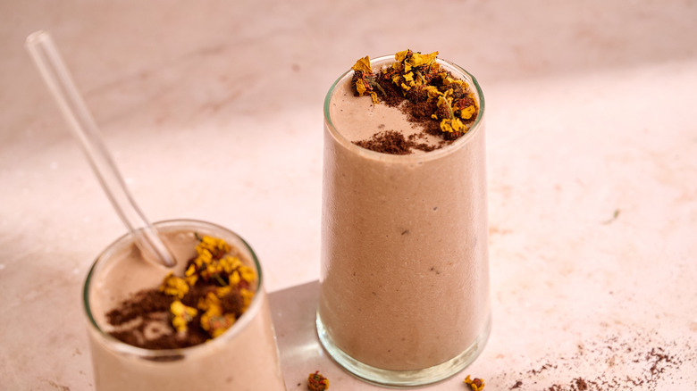 coffee smoothies in glasses with espresso powder and straw