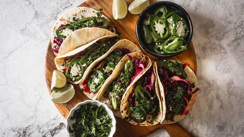 duck confit tacos with toppings