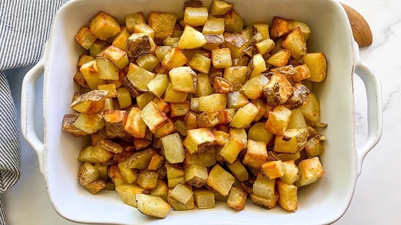 Dish filled with roasted potatoes