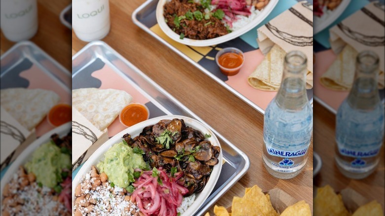 Burrito bowls on a silver tray 