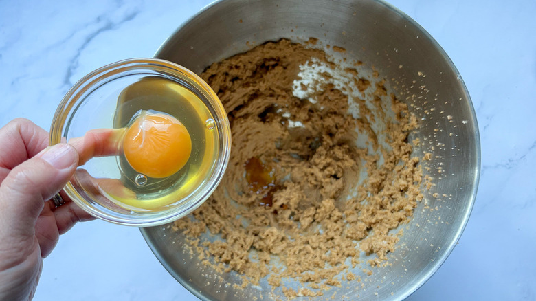 adding egg to batter