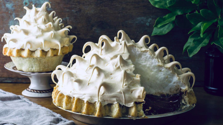 Chocolate meringue pie on table