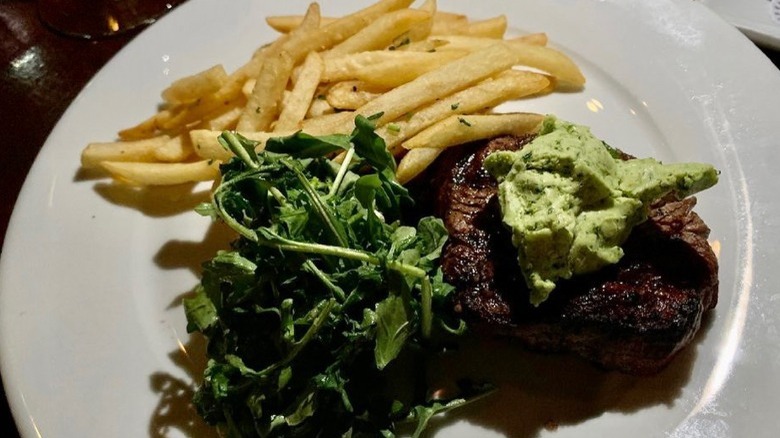 Steak and fries with butter