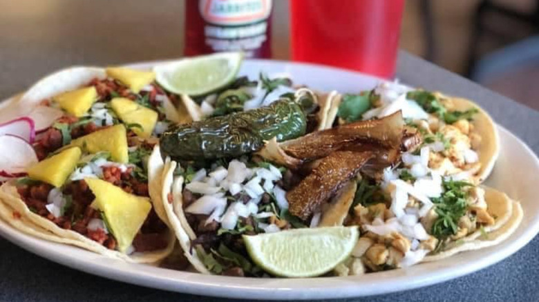 plate of tacos with garnishes