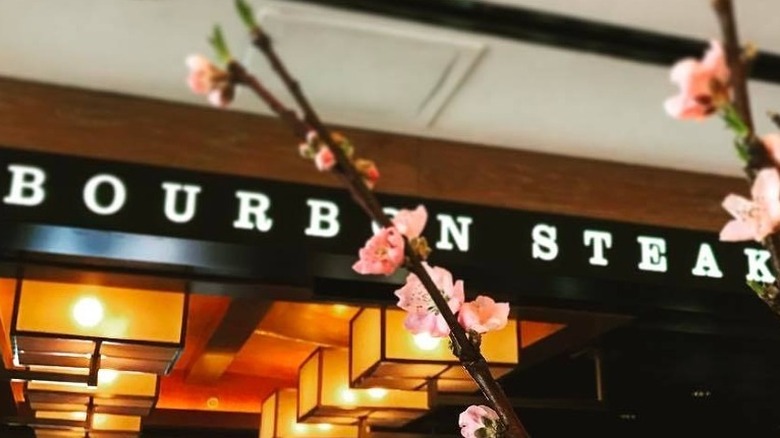 Bourbon Steak sign with cherry blossoms