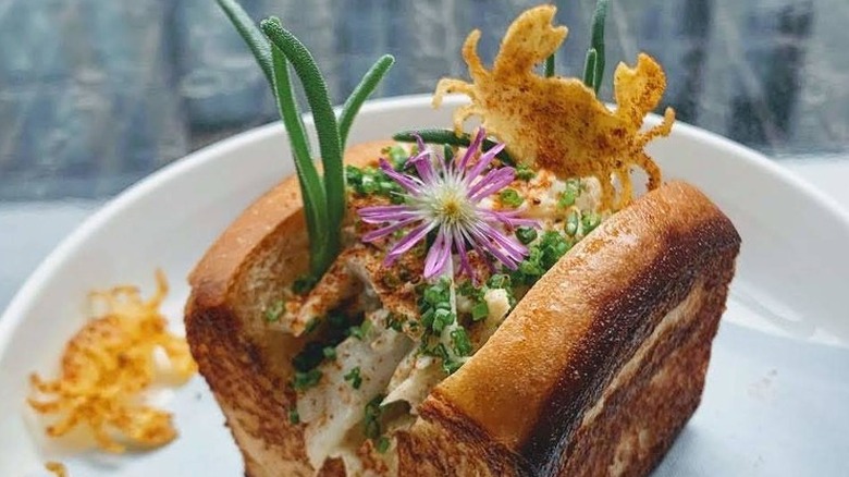 Artistic crab roll with blossoms