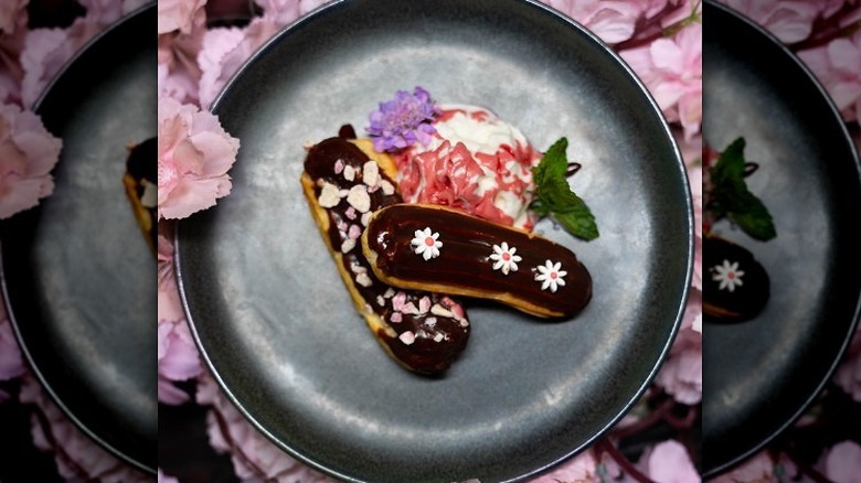 Chocolate eclair topped with blossoms