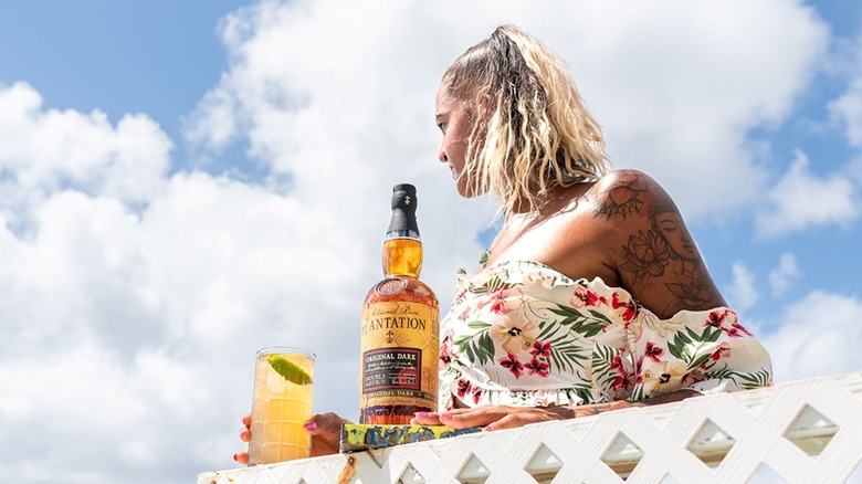 Woman with cocktail and Plantation Rum