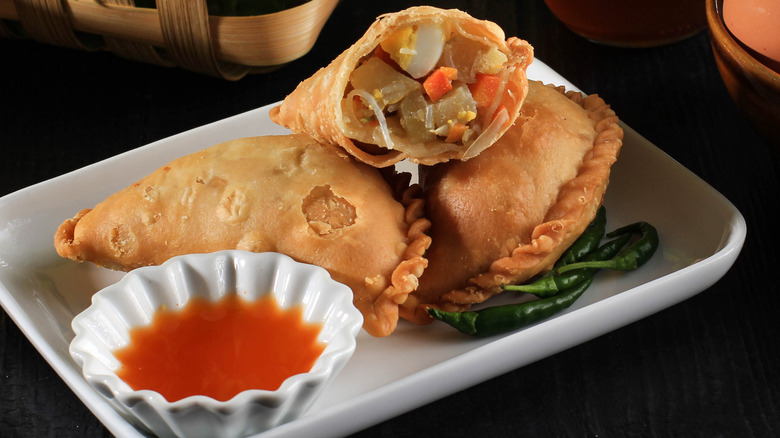 Malaysian curry puffs on a plate