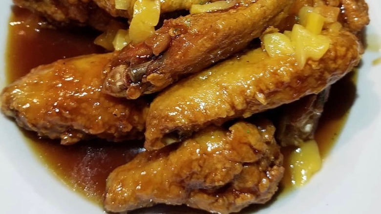 Peach wings on white plate