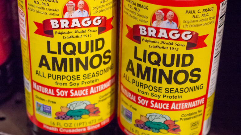 two bottles of Bragg liquid aminos