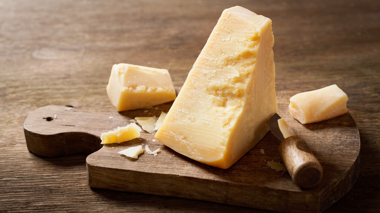 parmesan cheese on a wooden board