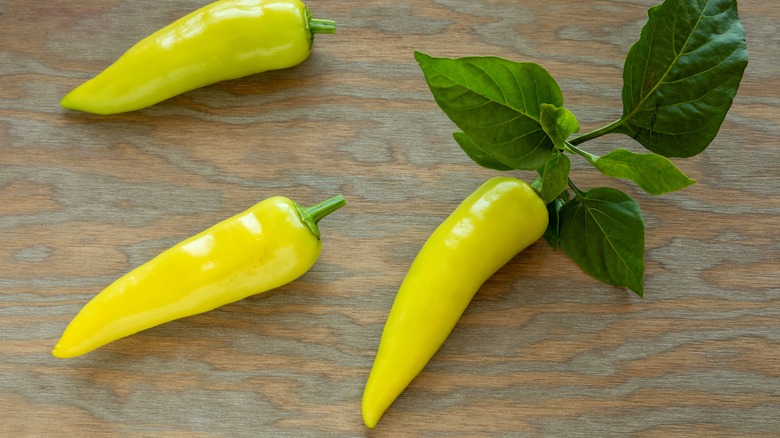 Hungarian Wax peppers on wood surface