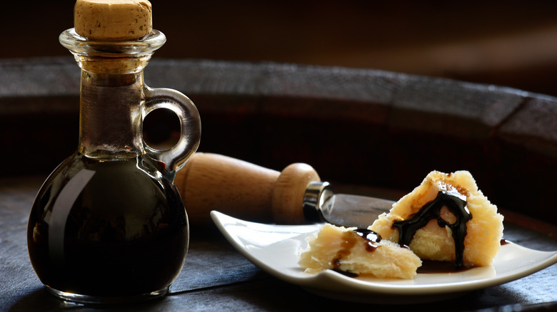 Balsamic vinegar poured over cheese