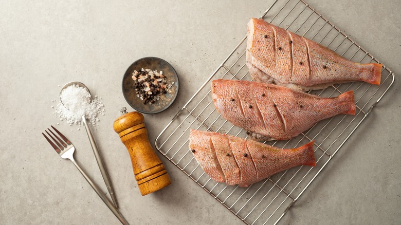 Butterflied rockfish prepared for grilling