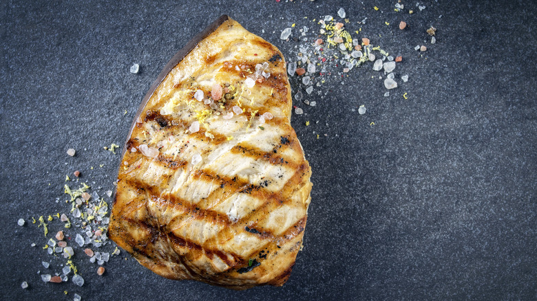 Grilled swordfish steak with coarse salt
