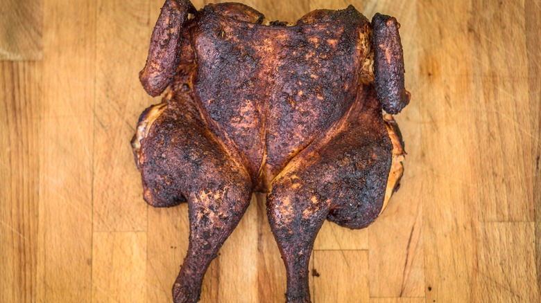 Spatchcocked chicken on wood